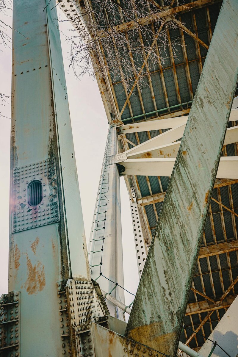 Rustic steel beams and rivets of a bridge in Portland, Oregon.